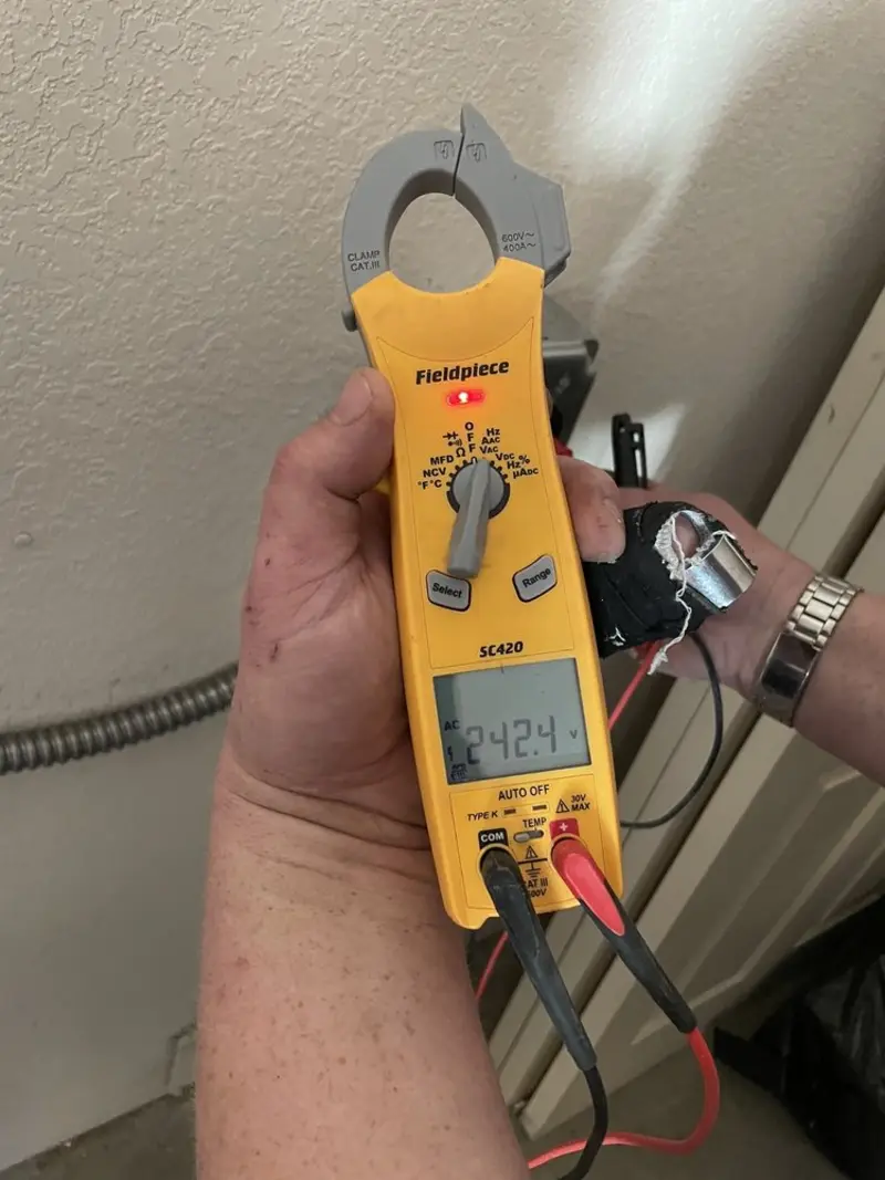 Voltage testing with clamp meter during Ceiling Fan Installation in Pinson